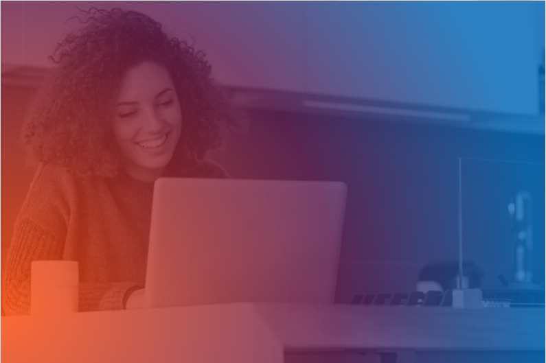 women smiling and browsing in her laptop